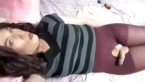 Shemale is playing with herself and riding a dildo